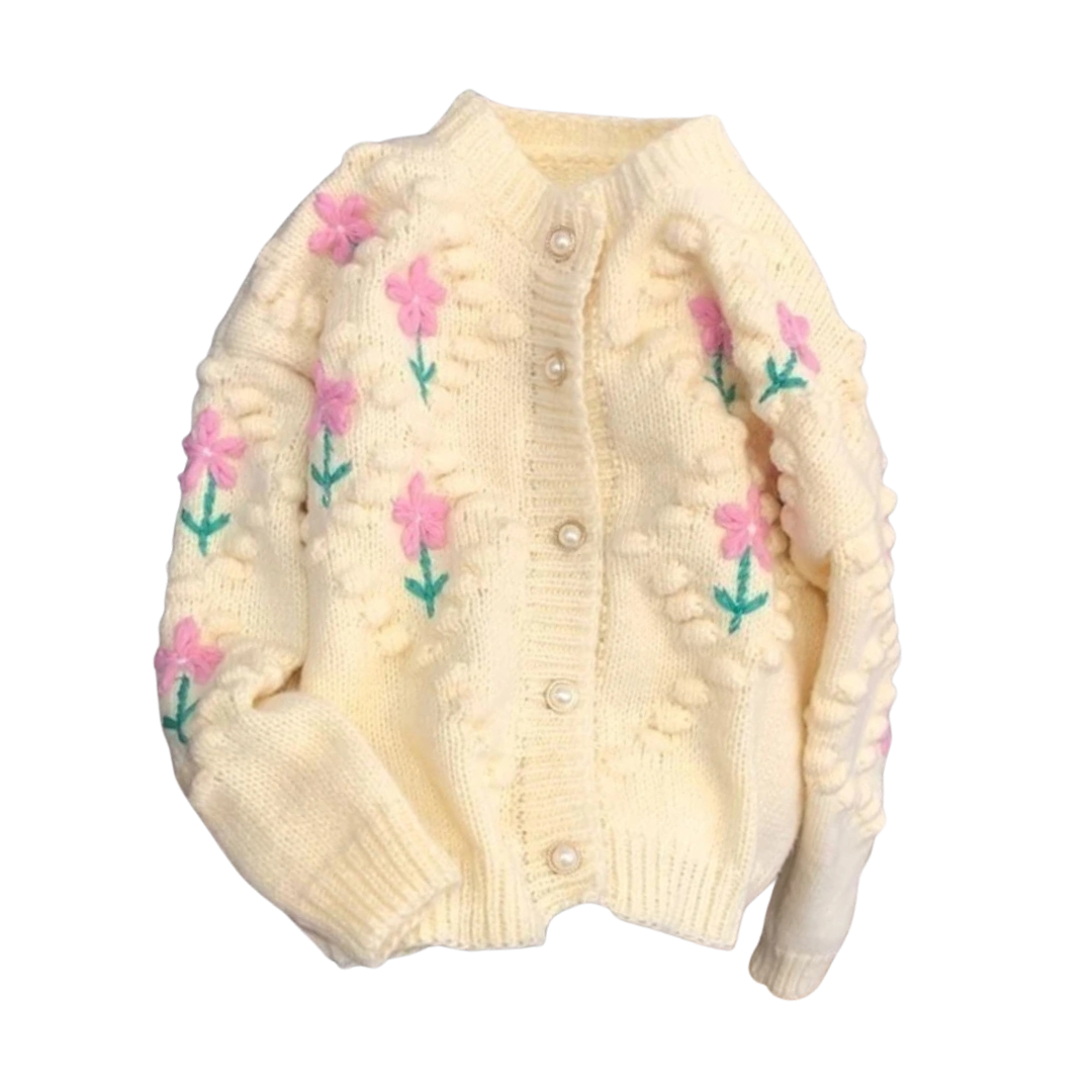 Cream-colored cardigan with floral patterns on a white background